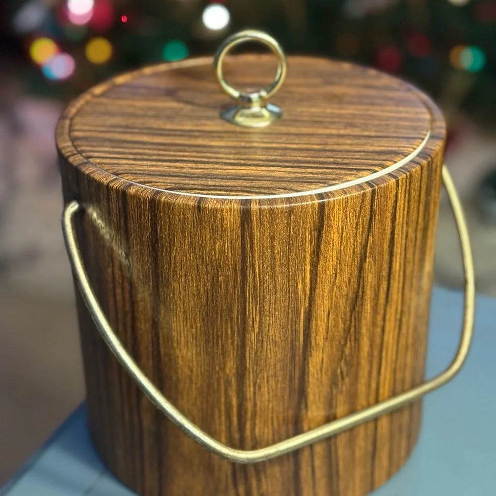 Vintage faux wood ice bucket, likely produced in the 1960s or 1970s
